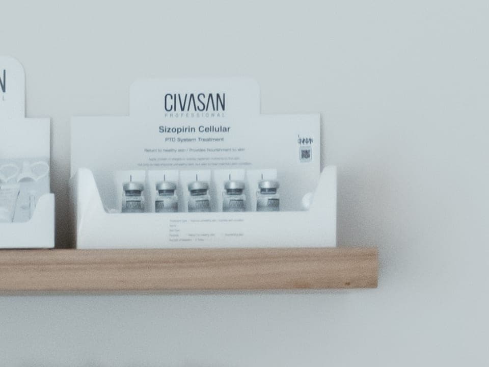A Civasan Professional ampoule display on the studio shelf, labelled Sizopirin Cellular