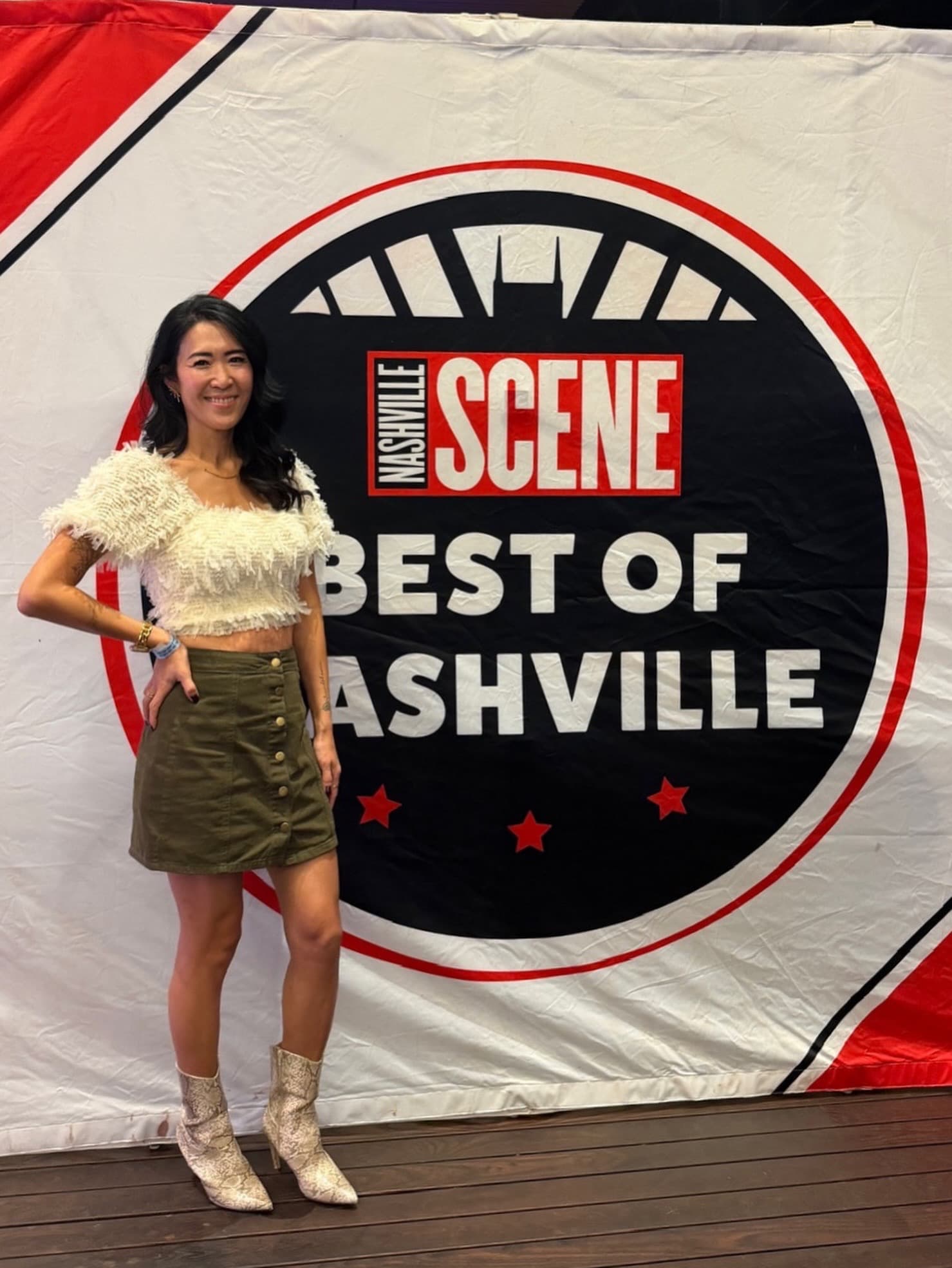 Kay Mason beside the Nashville Scene’s Best of Nashville banner at the 2026 event